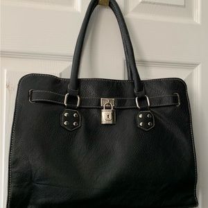 Beautiful, Non-branded Black Vegan Leather Satchel with silver tone accent lock.
